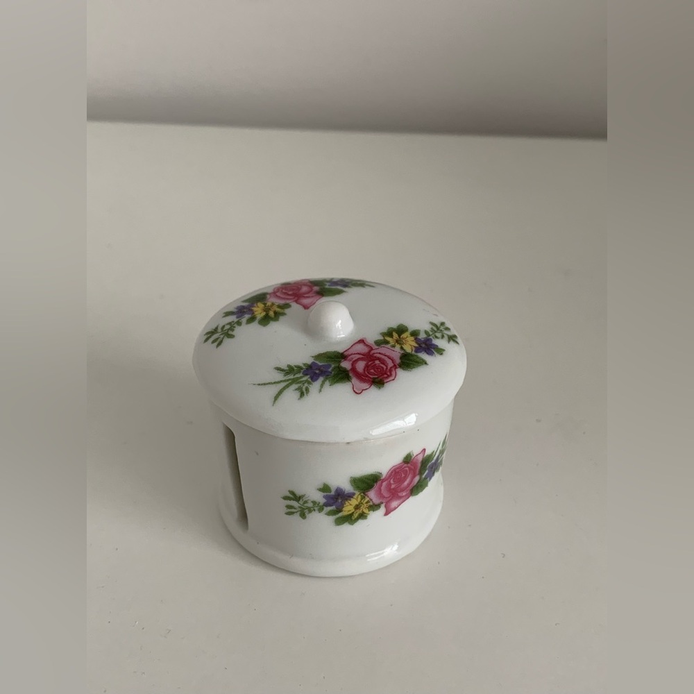 Porcelain stamp roll holder